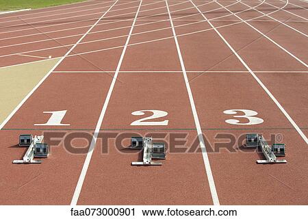Starting blocks at starting line on running track View Large Photo Image Stock Image - Starting blocks at starting line on running track. Fotosearch