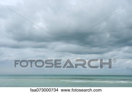 Stormy skies over sea View Large Photo Image Picture - Stormy skies over sea. Fotosearch