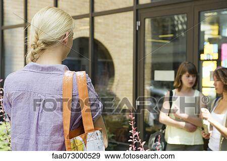 Stock Photo - Students on college campus. Fotosearch