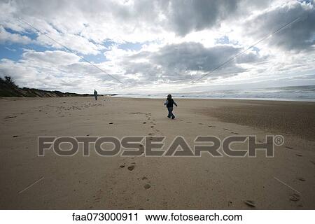 Toddler walking on beach View Large Photo Image Stock Image - Toddler walking on beach. Fotosearch