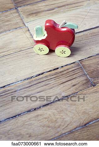 Toy car on hardwood floor View Large Photo Image Stock Image - Toy car on hardwood floor. Fotosearch