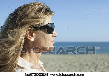 Woman at the beach, portrait View Large Photo Image Stock Photo - Woman at the beach, portrait. Fotosearch