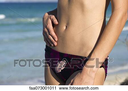 Woman in bikini bottom, mid section View Large Photo Image Stock Image - Woman in bikini bottom, mid section. Fotosearch