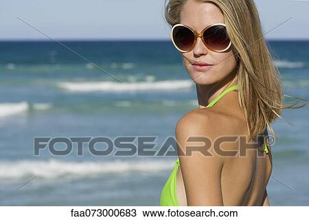 Woman in bikini by sea View Large Photo Image Stock Image - Woman in bikini by sea. Fotosearch