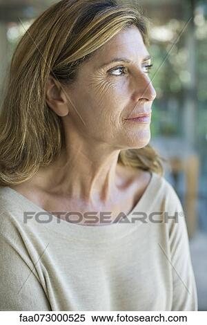 Woman looking away in thought, portrait View Large Photo Image Stock Photography - Woman looking away in thought, portrait. Fotosearch