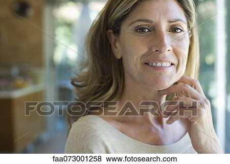 Stock Photo - Woman smiling, portrait. Fotosearch