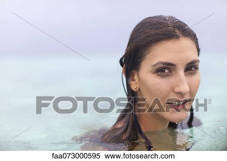 Stock Photography - Woman swimming, portrait. Fotosearch