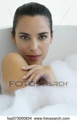 Picture - Woman taking bubble bath. Fotosearch