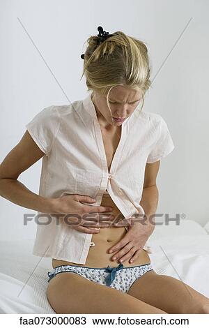 Woman with stomachache View Large Photo Image Stock Image - Woman with stomachache. Fotosearch
