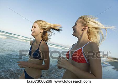 Women jogging at the beach View Large Photo Image Stock Photo - Women jogging at the beach. Fotosearch