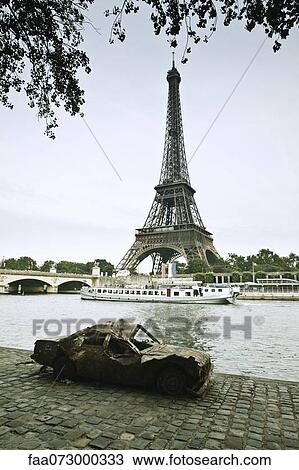 Wrecked car abandoned along Seine River near Eiffel Tower, Paris, France View Large Photo Image Stock Image - Wrecked car abandoned along Seine River near Eiffel Tower, Paris, France. Fotosearch