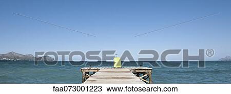 Yellow suitcase at end of dock View Large Photo Image Stock Image - Yellow suitcase at end of dock. Fotosearch