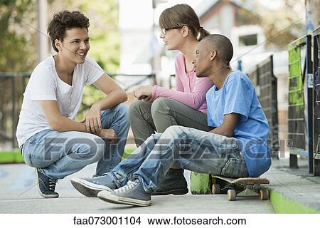 Picture - Young people hanging out together. Fotosearch