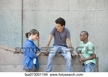 Young people hanging out together View Large Photo Image Picture - Young people hanging out together. Fotosearch