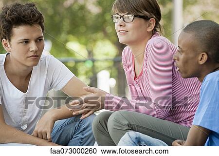 Young people hanging out together View Large Photo Image Stock Image - Young people hanging out together. Fotosearch