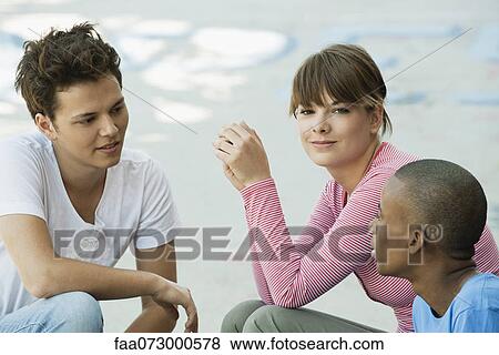Young people hanging out together View Large Photo Image Stock Photo - Young people hanging out together. Fotosearch
