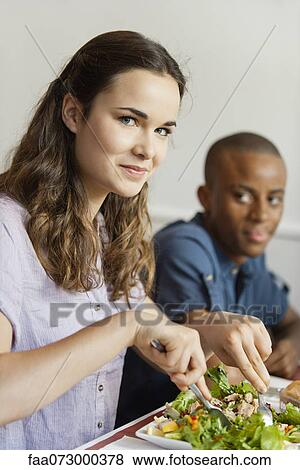 Young woman dining in restaurant View Large Photo Image Stock Photo - Young woman dining in restaurant. Fotosearch