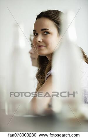 Young woman in restaurant View Large Photo Image Stock Image - Young woman in restaurant. Fotosearch