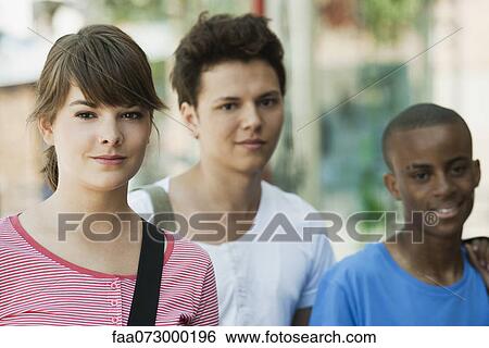 Stock Photograph - Young woman with friends. Fotosearch