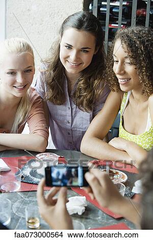 Young women smiling for picture View Large Photo Image Picture - Young women smiling for picture. Fotosearch