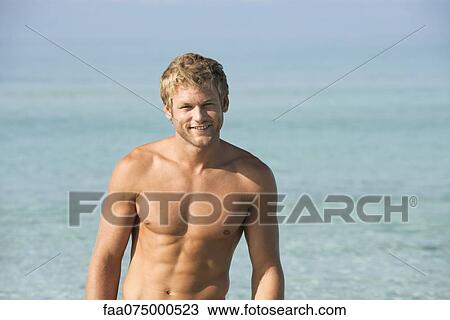 Barechested young man in water, portrait View Large Photo Image Stock Image - Barechested young man in water, portrait. Fotosearch