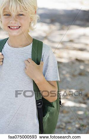 Boy carrying backpack, portrait View Large Photo Image Stock Image - Boy carrying backpack, portrait. Fotosearch