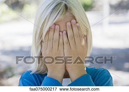 Boy covering face with hands View Large Photo Image Stock Photo - Boy covering face with hands. Fotosearch