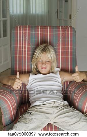 Boy smiling with thumbs up, portrait View Large Photo Image Stock Photo - Boy smiling with thumbs up, portrait. Fotosearch