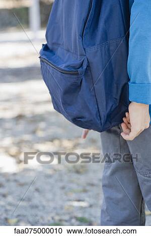 Boy with backpack, mid section View Large Photo Image Stock Image - Boy with backpack, mid section. Fotosearch