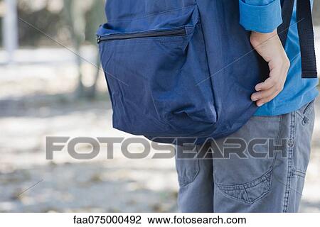 Boy with backpack, mid section View Large Photo Image Stock Image - Boy with backpack, mid section. Fotosearch