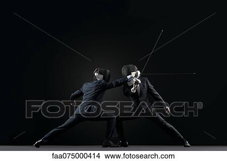 Businessmen fencing View Large Photo Image Picture - Businessmen fencing. Fotosearch