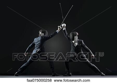 Businessmen fencing View Large Photo Image Stock Photo - Businessmen fencing. Fotosearch