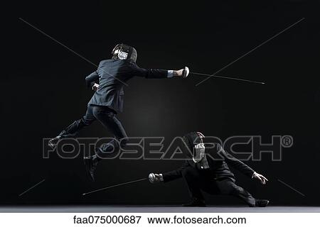 Businessmen fencing View Large Photo Image Stock Photo - Businessmen fencing. Fotosearch