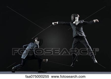 Businessmen fencing View Large Photo Image Stock Photography - Businessmen fencing. Fotosearch