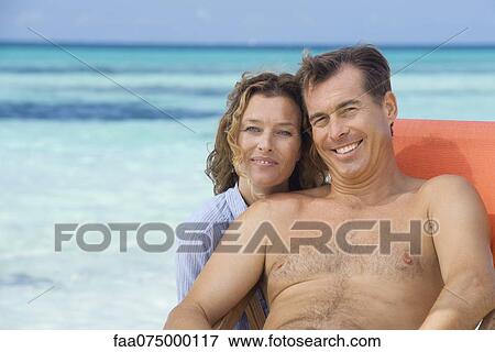 Couple at beach, portrait View Large Photo Image Stock Photo - Couple at beach, portrait. Fotosearch