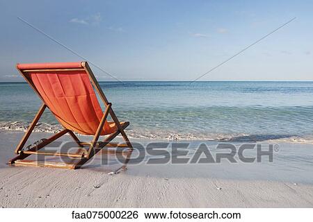 Empty deckchair on beach View Large Photo Image Stock Photograph - Empty deckchair on beach. Fotosearch