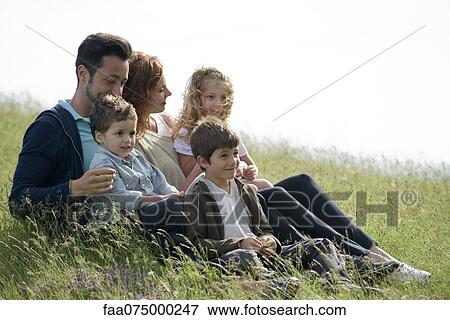 Family relaxing together outdoors View Large Photo Image Stock Photo - Family relaxing together outdoors. Fotosearch