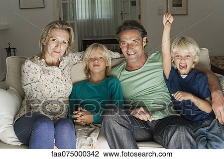 Family sitting on sofa, portrait View Large Photo Image Stock Image - Family sitting on sofa, portrait. Fotosearch