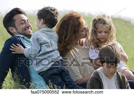 Family spending time together outdoors View Large Photo Image Stock Image - Family spending time together outdoors. Fotosearch