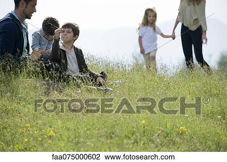 Family spending time together outdoors View Large Photo Image Stock Image - Family spending time together outdoors. Fotosearch