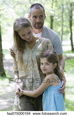 Family together outdoors, portrait View Large Photo Image Picture - Family together outdoors, portrait. Fotosearch