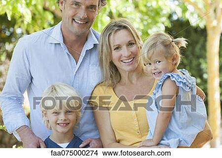 Family together outdoors, portrait View Large Photo Image Picture - Family together outdoors, portrait. Fotosearch