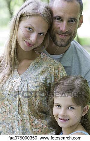 Family together outdoors, portrait View Large Photo Image Stock Image - Family together outdoors, portrait. Fotosearch