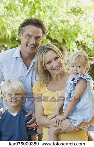 Family together outdoors, portrait View Large Photo Image Stock Photo - Family together outdoors, portrait. Fotosearch