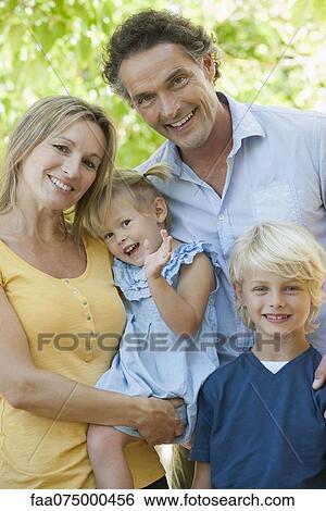 Family together outdoors, portrait View Large Photo Image Stock Photograph - Family together outdoors, portrait. Fotosearch