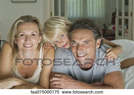 Family with one child, portrait View Large Photo Image Stock Image - Family with one child, portrait. Fotosearch