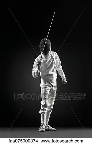 Fencers holding up foil, portrait View Large Photo Image Picture - Fencers holding up foil, portrait. Fotosearch