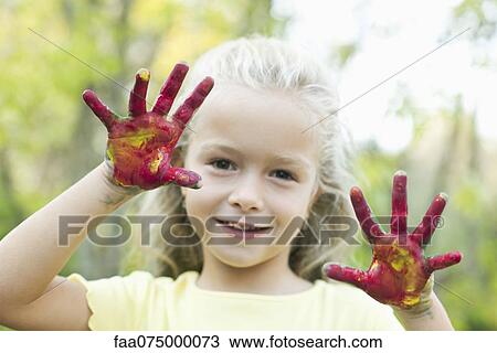 Girl with paint covered hands, portrait View Large Photo Image Stock Image - Girl with paint covered hands, portrait. Fotosearch