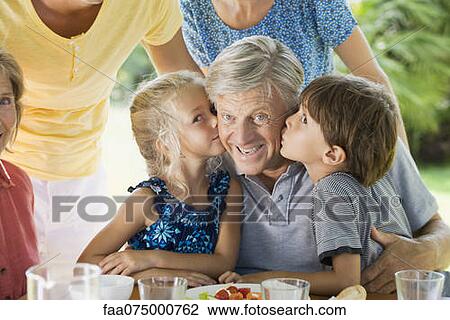 Grandchildren kissing grandfather, portrait View Large Photo Image Stock Image - Grandchildren kissing grandfather, portrait. Fotosearch