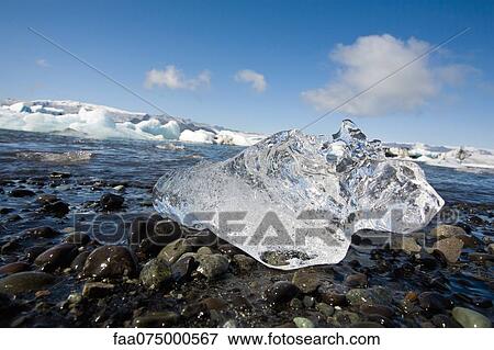 Ice melting in Jokulsarlon glacial lagoon, Iceland View Large Photo Image Stock Photo - Ice melting in Jokulsarlon glacial lagoon, Iceland. Fotosearch